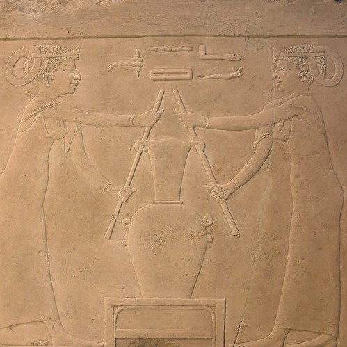 Egypt Lily Perfume Ancient stone depiction of two women blending lily perfume