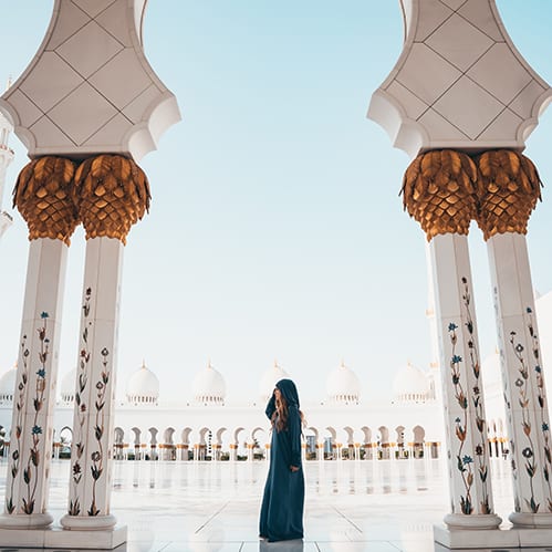 Archways in Bangladesh Photo depicting a young woman standing between two pillars in an arab nation